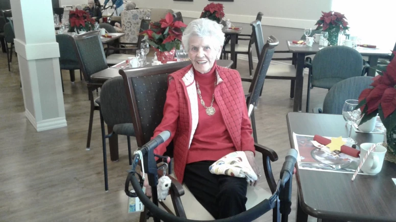 An elderly lady drinking coffee at Sagebrush's dining area